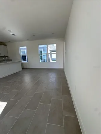 a kitchen with stainless steel appliances a stove a sink a microwave and cabinets