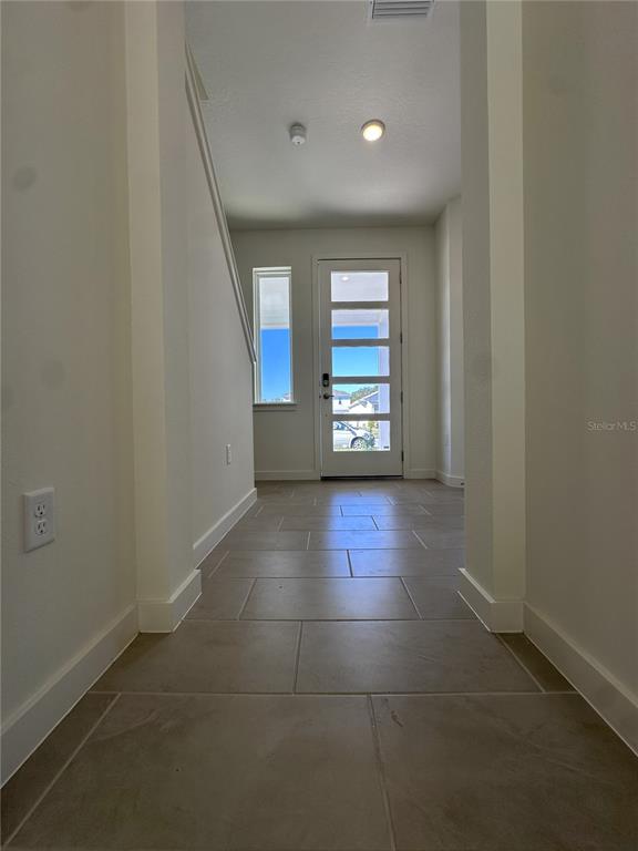 2059 Iorio Street St. Cloud, FL 34771 - Photo 23 of 61 a view of an empty room with a window