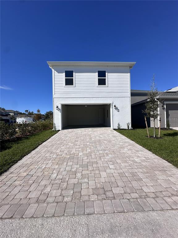 2059 Iorio Street St. Cloud, FL 34771 - Photo 25 of 61 a front view of a house with a yard