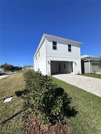 a view of hallway with closet and wooden floor