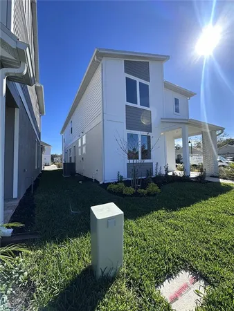 a view of a back yard of the house and front view of a house