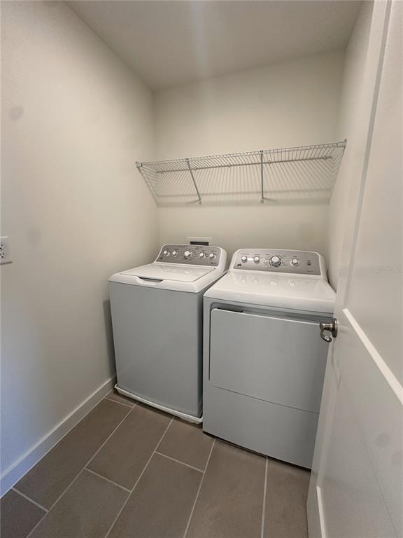 2059 Iorio Street St. Cloud, FL 34771 - Photo 36 of 61 a utility room with dryer and washer