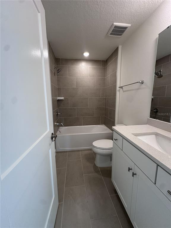 2059 Iorio Street St. Cloud, FL 34771 - Photo 37 of 61 a bathroom with a granite countertop sink toilet and shower