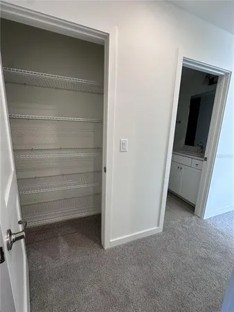 a room with a mirror and a sink