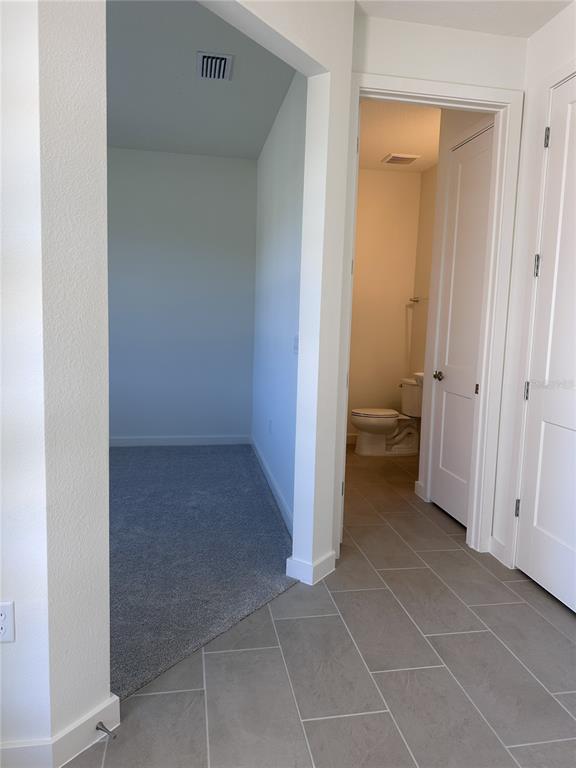 2059 Iorio Street St. Cloud, FL 34771 - Photo 7 of 61 a view of a bathroom with a sink and a toilet