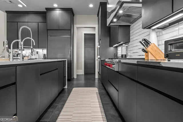 a bathroom with a mirror and a sink