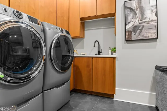 a living room with a bed furniture and a flat screen tv
