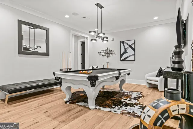 a living room with fireplace furniture and a large window