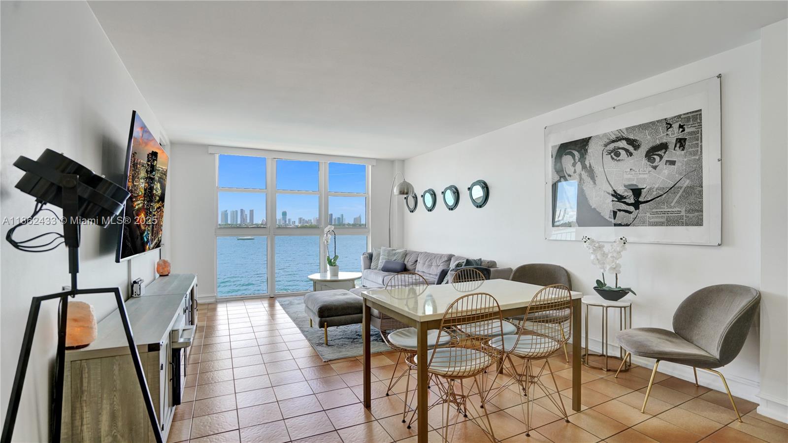 1228 West Avenue, Unit 201 Miami Beach, FL 33139 - Photo 11 of 42 a view of a workspace with furniture and a couch