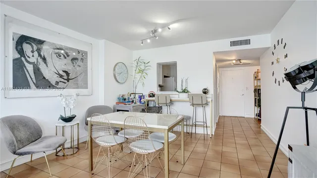 a kitchen with granite countertop a sink stove and refrigerator