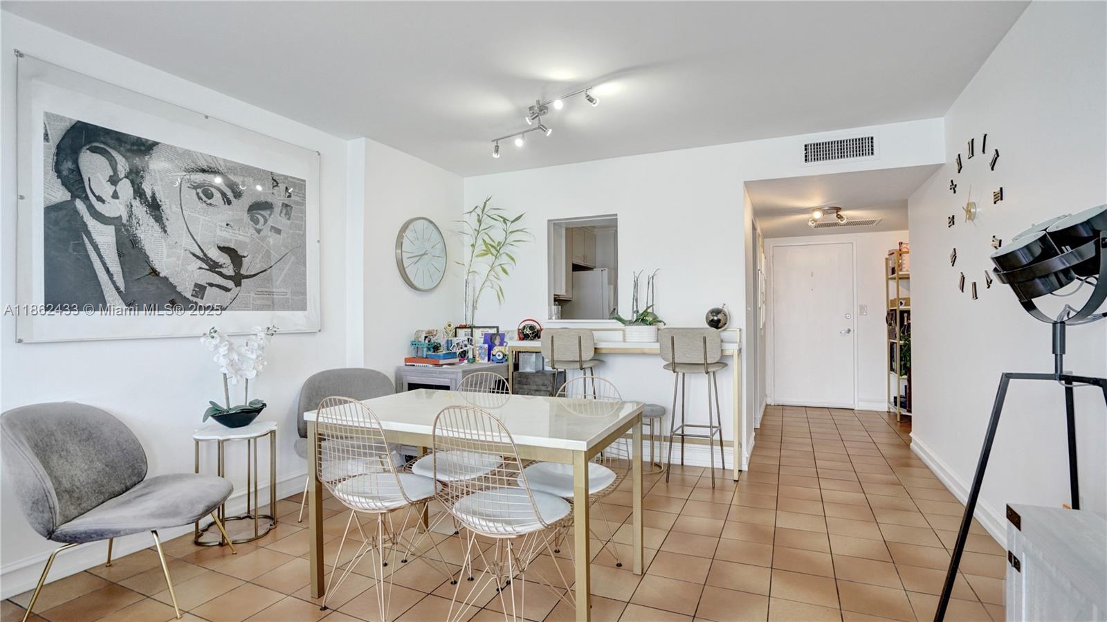 1228 West Avenue, Unit 201 Miami Beach, FL 33139 - Photo 14 of 42 a dining room with furniture and window