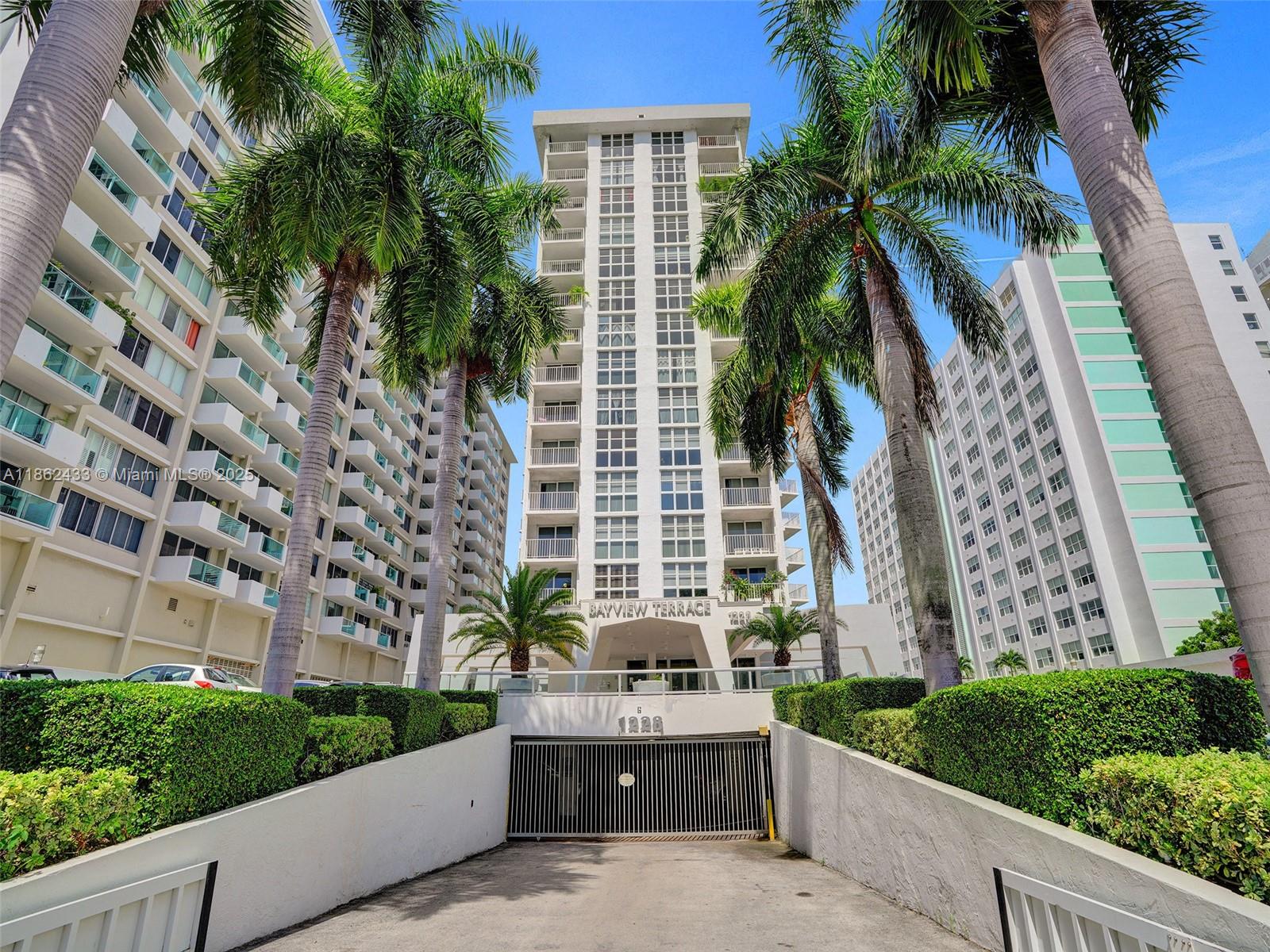1228 West Avenue, Unit 201 Miami Beach, FL 33139 - Photo 33 of 42 a view of a house with a yard and potted plants