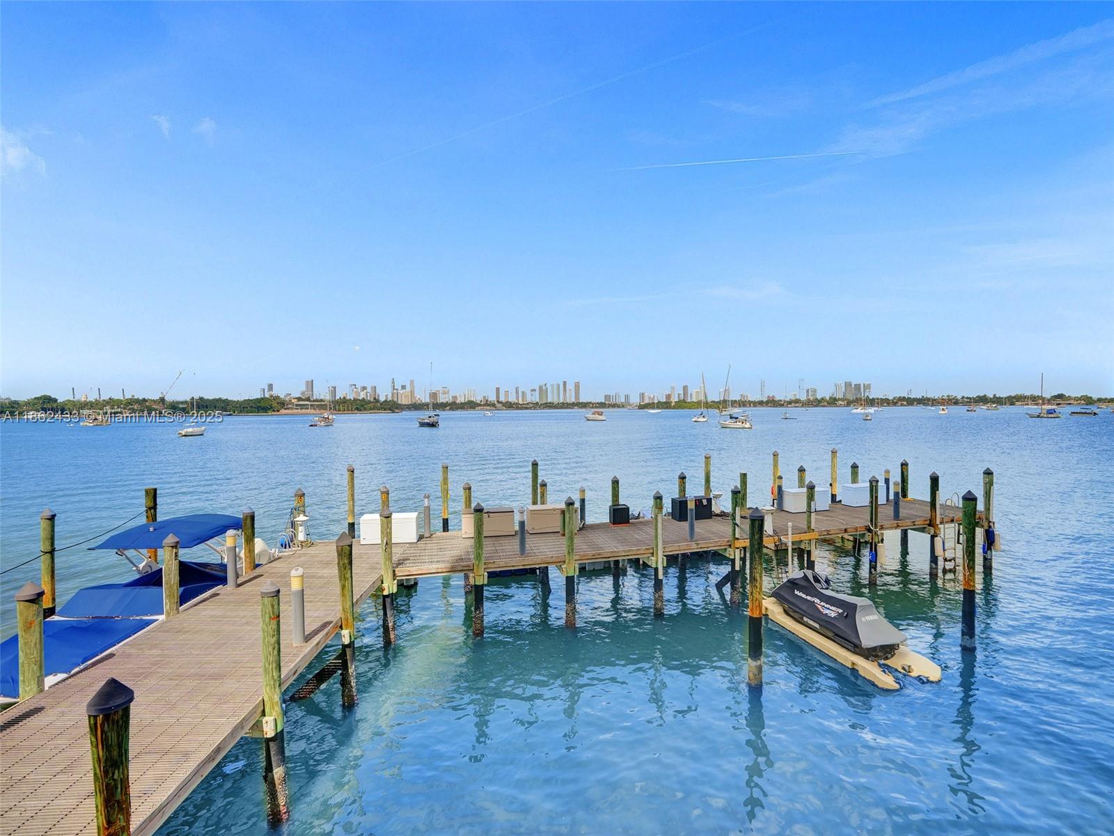 1228 West Avenue, Unit 201 Miami Beach, FL 33139 - Photo 6 of 42 a roof deck with table and chairs