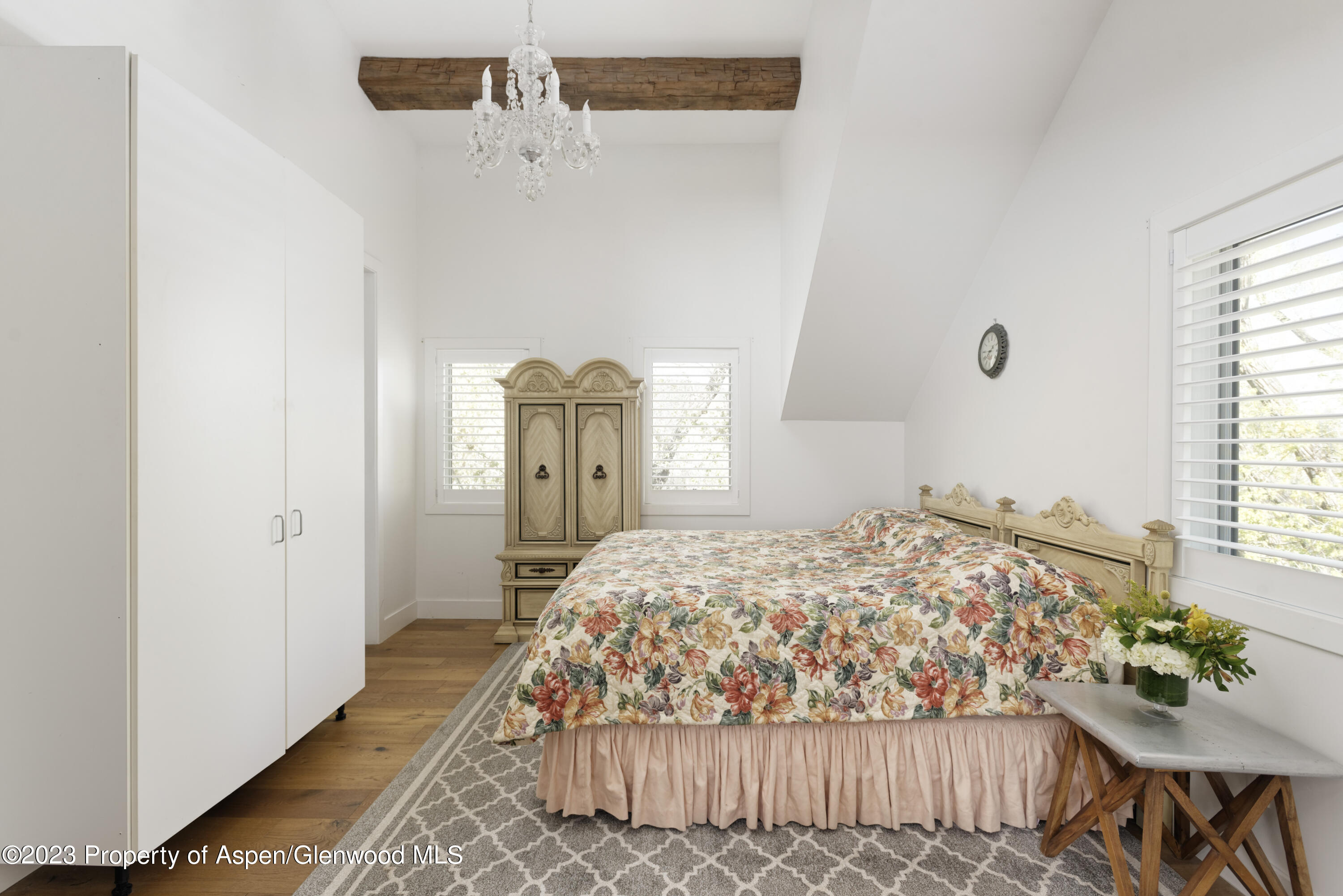 1649 Emma Spur Basalt, CO 81621 - Photo 19 of 35 a bedroom with a bed and a table