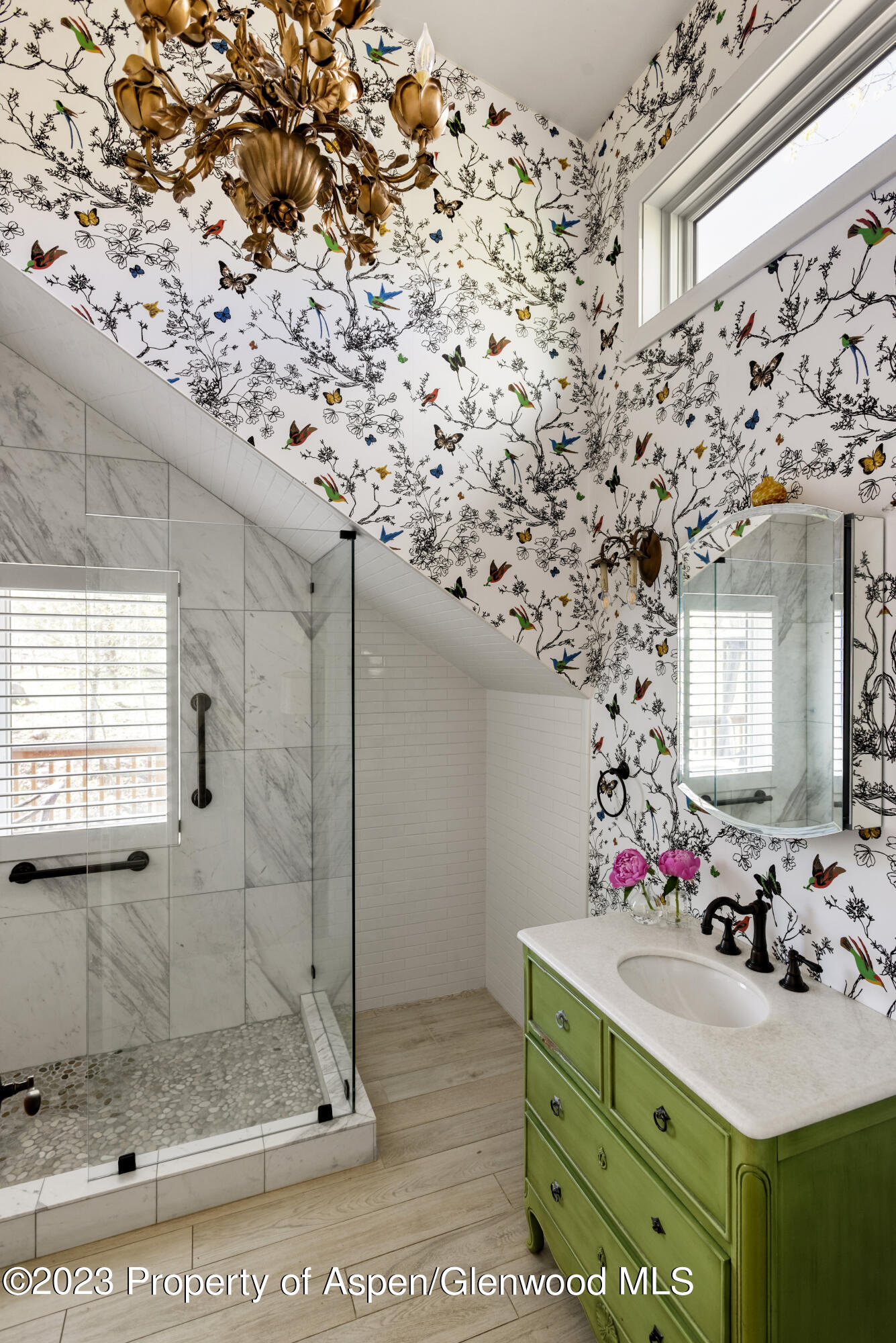 1649 Emma Spur Basalt, CO 81621 - Photo 20 of 35 a bathroom with a sink mirror and shower