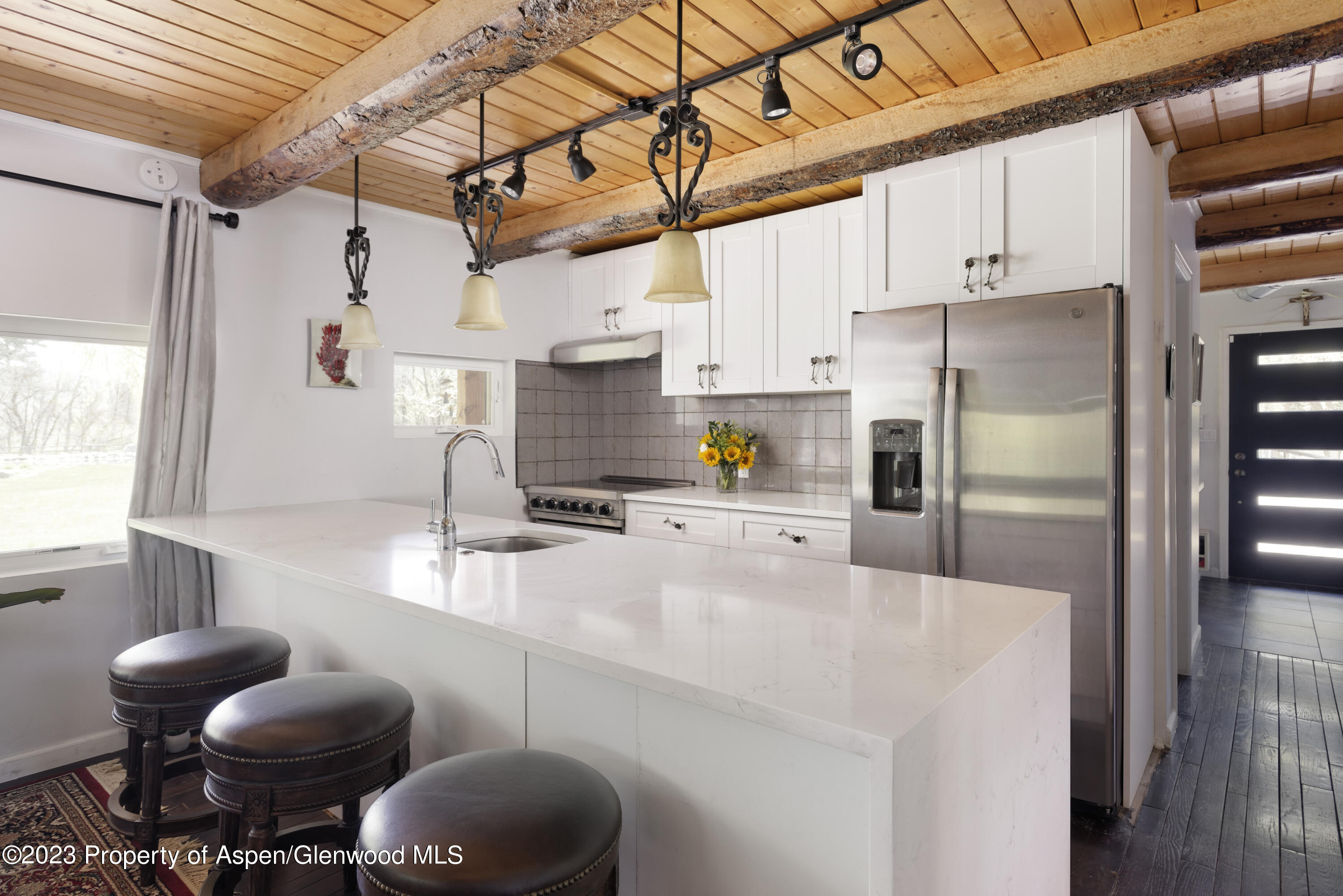 1649 Emma Spur Basalt, CO 81621 - Photo 6 of 35 a kitchen with stainless steel appliances a refrigerator and a stove