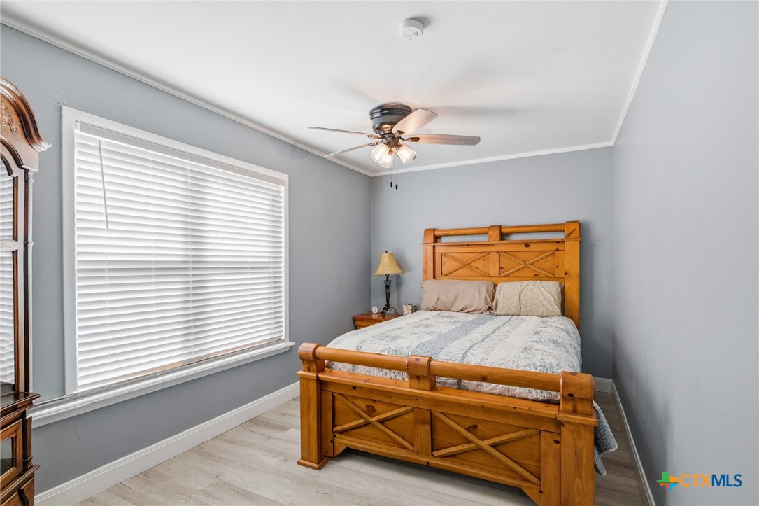 201 Pheasant Drive Victoria, TX 77905 - Photo 13 of 20 a bedroom with a bed and a window