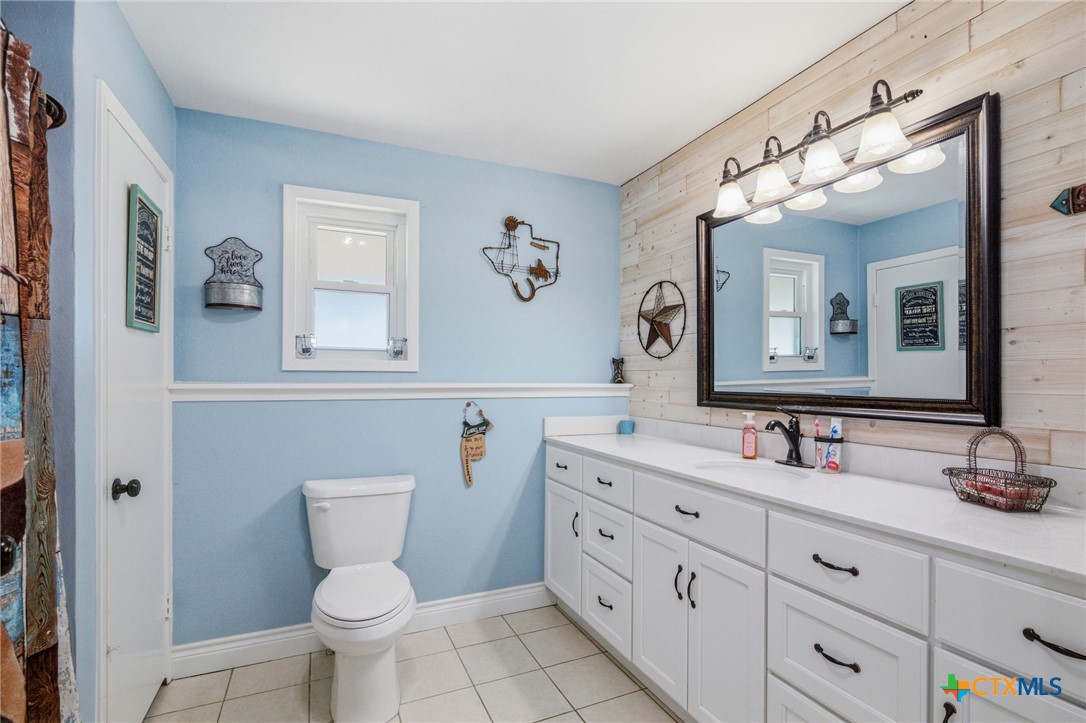 201 Pheasant Drive Victoria, TX 77905 - Photo 16 of 20 a bathroom with a double vanity sink mirror and toilet