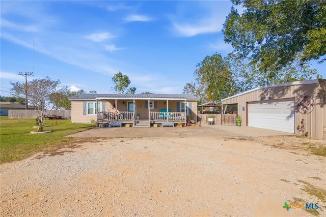 front view of a house with a patio