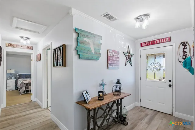 a room with furniture and wooden floor