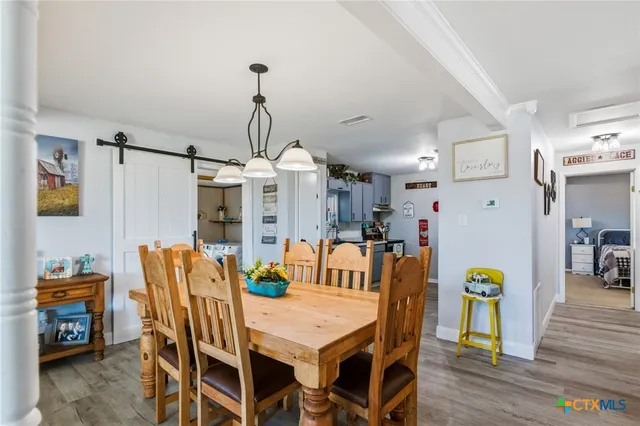 a view of a dining room with furniture