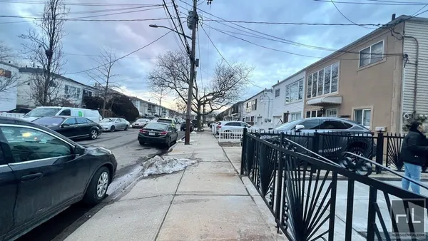 a view of a street with cars
