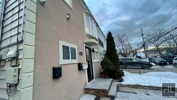 a view of a house with a bench