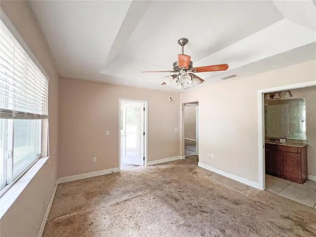 a bathroom with a toilet a sink and a mirror