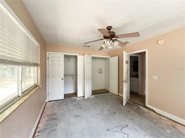 a view of an empty room and a window
