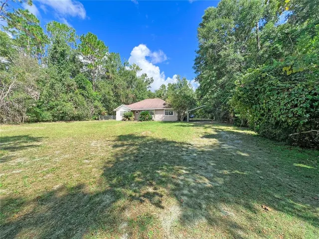 a view of a lake with a yard
