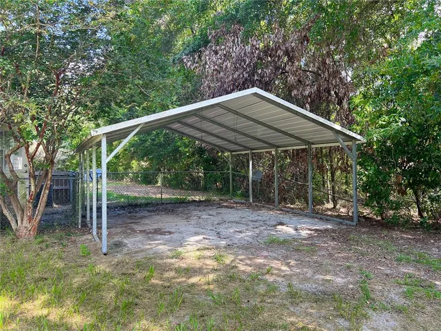 a backyard of a house with lots of green space