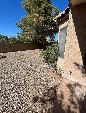 a view of a chairs and tables in the patio