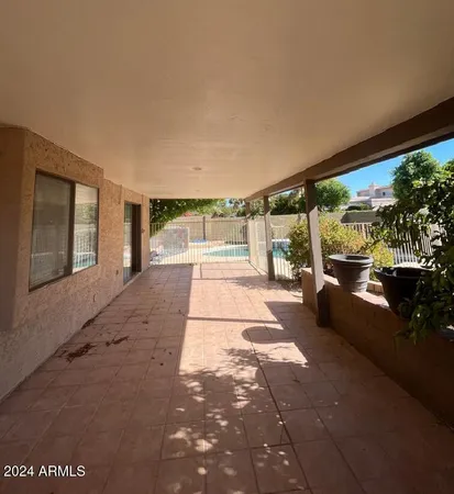 a view of balcony with wooden floor