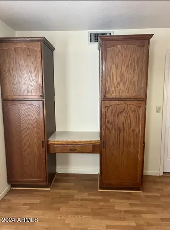 a view of front door with wooden floor