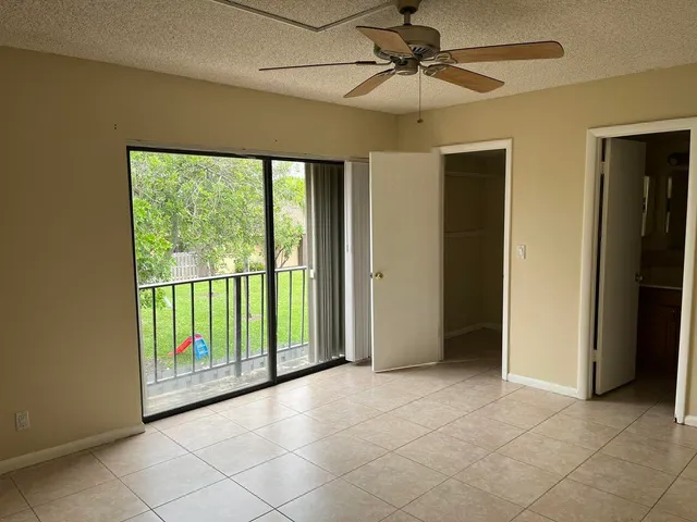 a view of livingroom with furniture and chandelier fan