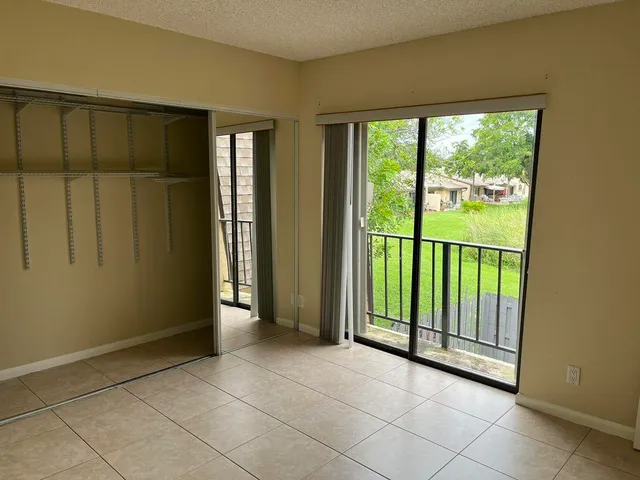 a view of a room that has a large window