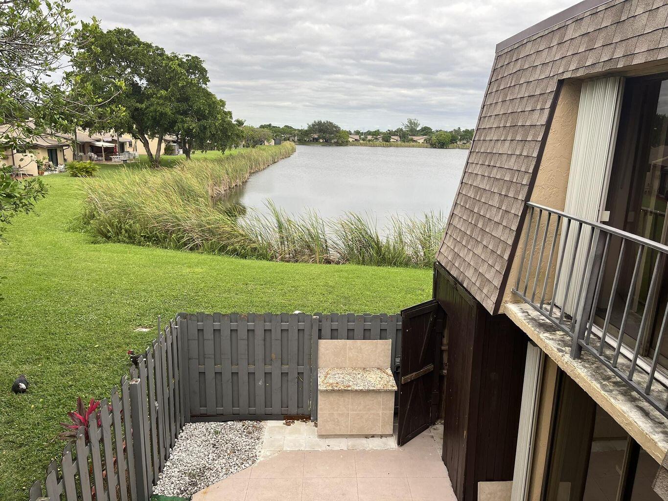 4602 Waterview Circle Palm Springs, FL 33461 - Photo 13 of 13 a view of a balcony with lake view