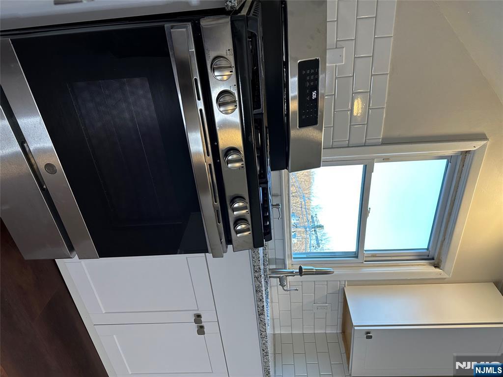 636-3 Ringwood Avenue, Unit 3 Wanaque, NJ 07465 - Photo 6 of 15 a stove top oven sitting inside of a kitchen