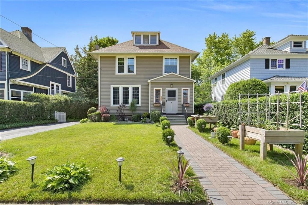 77 4th Street Meriden, CT 06451 - Photo 1 of 1 a front view of a house with a yard