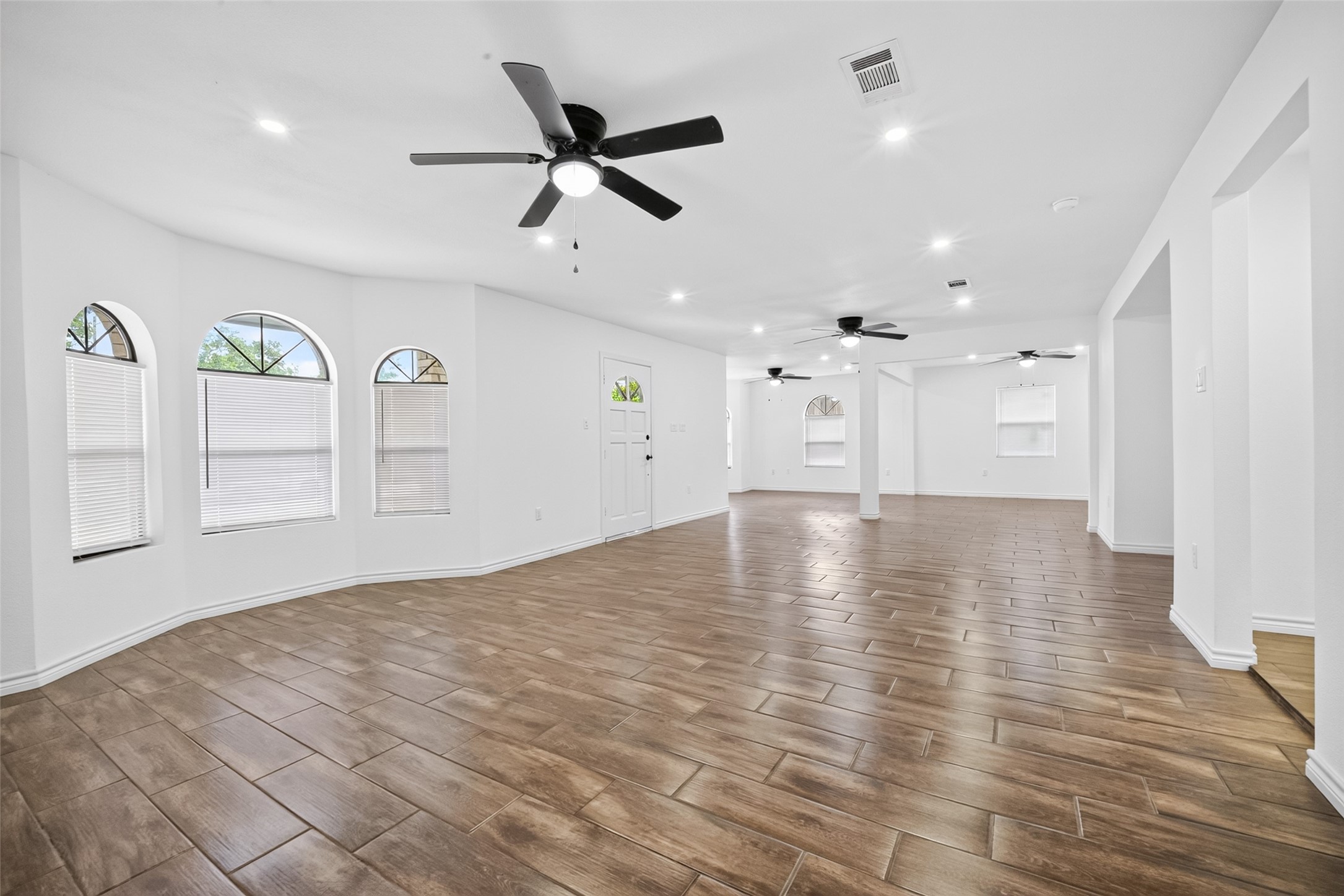 3530 Rosedale Street Houston, TX 77004 - Photo 7 of 50 Experience airy comfort with ceiling fans, stylish recessed lighting, and charming windows.