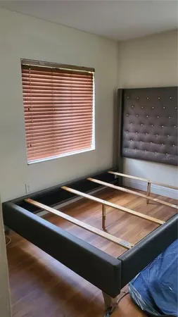 a room with pool table and windows