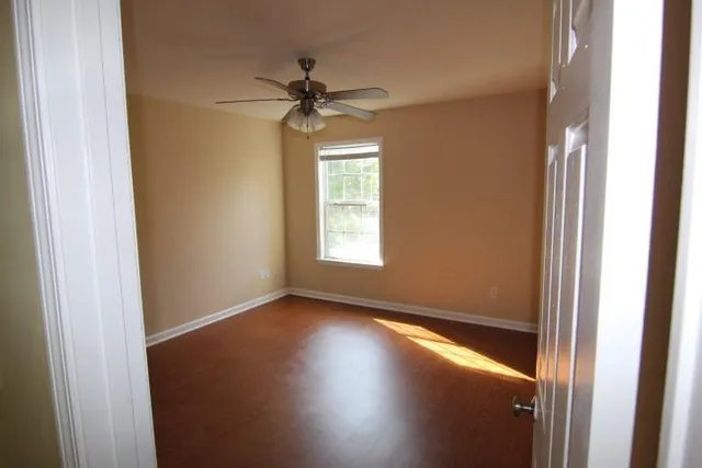 an empty room that has a window in it