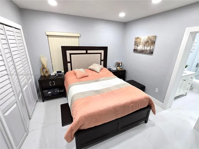 a bedroom with a bed and a dresser