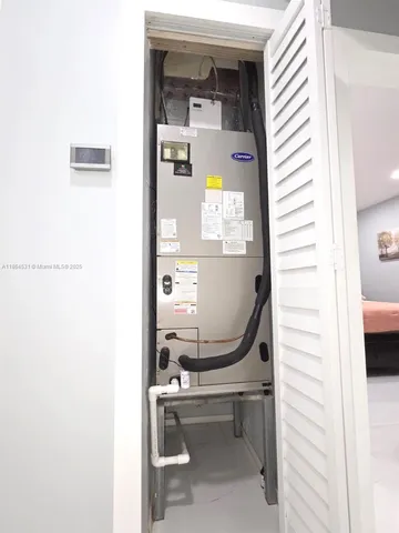 a utility room with sink dryer and washer