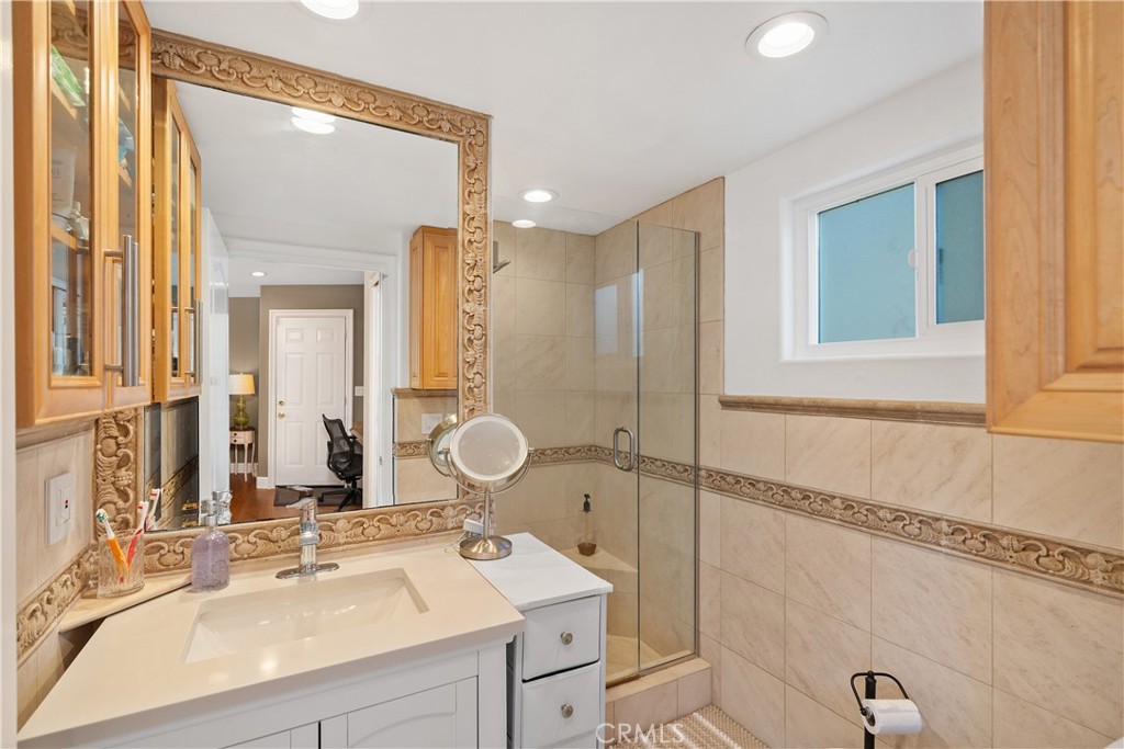 7901 Berger Avenue Playa del Rey, CA 90293 - Photo 30 of 67 a bathroom with a double vanity sink mirror and shower