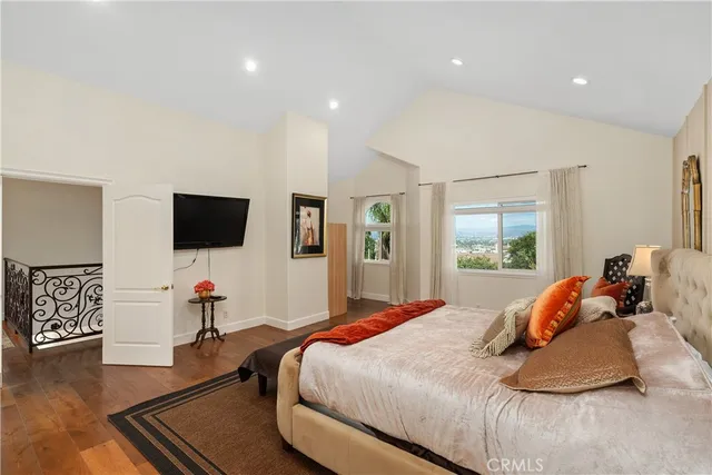a bathroom with a tub sink shower and mirror