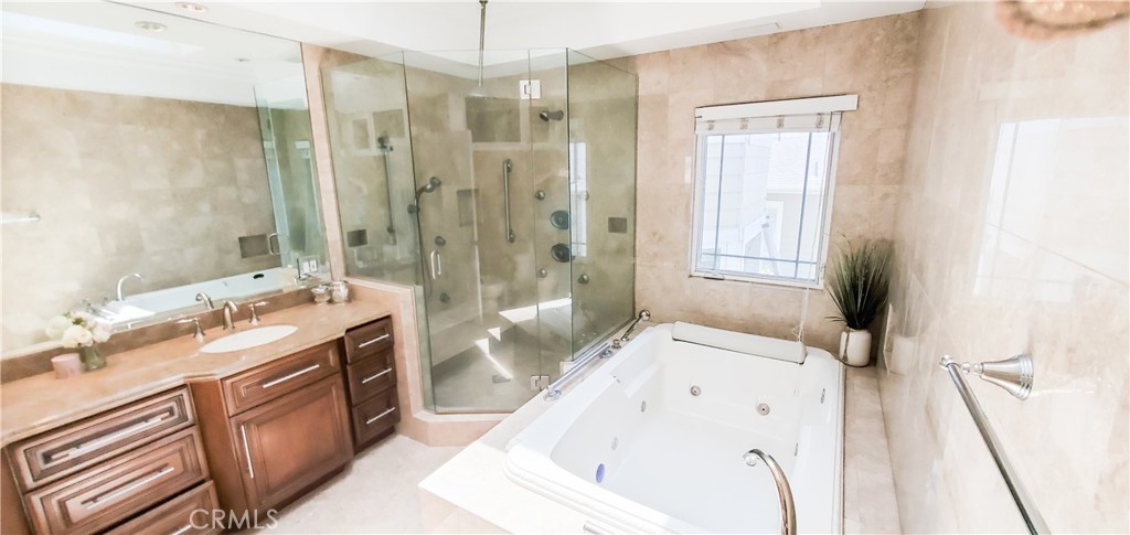 7901 Berger Avenue Playa del Rey, CA 90293 - Photo 39 of 67 a bathroom with a tub sink a mirror a vanity and a shower