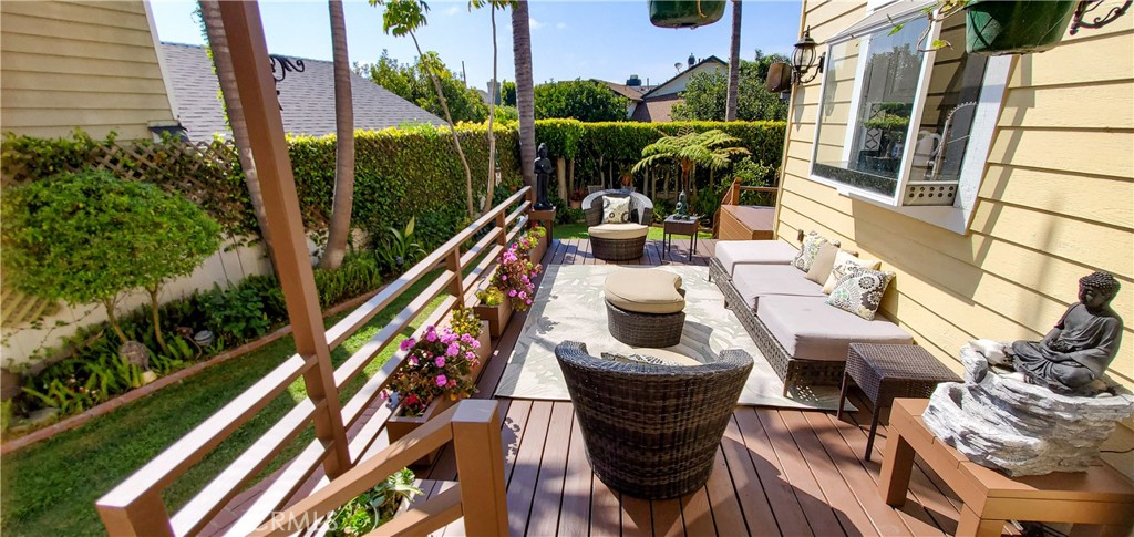 7901 Berger Avenue Playa del Rey, CA 90293 - Photo 54 of 67 a roof deck with table and chairs potted plants with wooden floor and fence