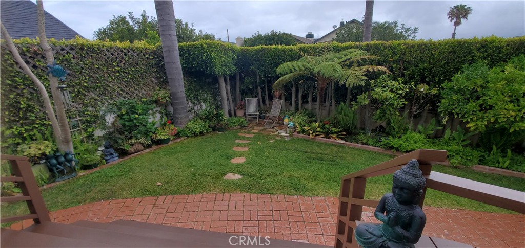 7901 Berger Avenue Playa del Rey, CA 90293 - Photo 60 of 67 a view of a house with a yard and potted plants