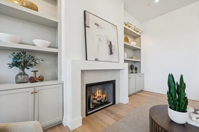 a dining room with furniture a chandelier and window